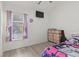 Bright bedroom with a window, a dresser, and a cute cartoon-themed bed at 2569 Devonshire Ct # 72, Denver, CO 80229