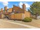 Exterior elevation with fenced in patio at 2569 Devonshire Ct # 72, Denver, CO 80229