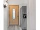 The entryway features a decorative front door and a stainless steel refrigerator at 2569 Devonshire Ct # 72, Denver, CO 80229
