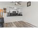 Bright kitchen with granite countertops, white cabinets, and stainless steel appliances open to the living area at 2569 Devonshire Ct # 72, Denver, CO 80229
