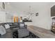Living room and kitchen with modern decor, comfortable seating, and vaulted ceiling at 2569 Devonshire Ct # 72, Denver, CO 80229