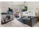Comfortable living room with a stone fireplace, high ceilings, and modern décor at 2569 Devonshire Ct # 72, Denver, CO 80229