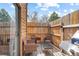 Outdoor patio featuring a grill, outdoor furniture, and wooden fencing at 2569 Devonshire Ct # 72, Denver, CO 80229