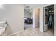 Bright Primary bathroom with vanity area leading into the bedroom at 13212 Clermont Cir, Thornton, CO 80241