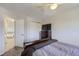 Comfortable carpeted bedroom with a ceiling fan and a closet with sliding doors at 13212 Clermont Cir, Thornton, CO 80241