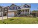 Charming two-story home with a well-manicured lawn and a welcoming front porch at 13212 Clermont Cir, Thornton, CO 80241