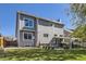 Back exterior view of a two story house with a nice patio and large backyard at 13212 Clermont Cir, Thornton, CO 80241