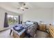 Calming main bedroom featuring a vaulted ceiling and a large window at 13212 Clermont Cir, Thornton, CO 80241