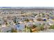 An aerial view of a neighborhood, showcasing the numerous houses, landscaping, and streets at 10058 Glenstone Cir, Highlands Ranch, CO 80130