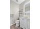 Stylish powder room features a vessel sink, modern lighting, and tiled wall accents at 10058 Glenstone Cir, Highlands Ranch, CO 80130