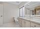 Well-lit bathroom with a modern vanity, a window, and a toilet at 10058 Glenstone Cir, Highlands Ranch, CO 80130