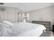 Neutral bedroom featuring a large window, dresser, and a walk in closet at 10058 Glenstone Cir, Highlands Ranch, CO 80130