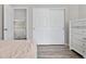 Bedroom with sliding closet doors, a dresser and wood-look floors at 10058 Glenstone Cir, Highlands Ranch, CO 80130