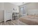 Bedroom featuring a desk, dresser, and window, offering both comfort and functionality at 10058 Glenstone Cir, Highlands Ranch, CO 80130