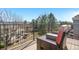 Relaxing outdoor deck area with comfortable wicker seating overlooking the backyard and neighborhood at 10058 Glenstone Cir, Highlands Ranch, CO 80130