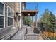 View of the outdoor deck with wicker furniture and a propane heater for relaxing at 10058 Glenstone Cir, Highlands Ranch, CO 80130