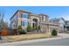 Beautiful two-story house featuring brick accents, manicured landscaping, and a spacious two-car garage at 10058 Glenstone Cir, Highlands Ranch, CO 80130