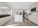 Bright kitchen with a center island, white cabinets, stainless steel appliances and open concept design at 10058 Glenstone Cir, Highlands Ranch, CO 80130