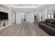 Spacious living room featuring light wood floors, neutral walls, and staircase to the second floor at 10058 Glenstone Cir, Highlands Ranch, CO 80130