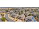 A wide angle street view of homes in the area with manicured lawns and mature trees at 10058 Glenstone Cir, Highlands Ranch, CO 80130