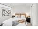 Tastefully decorated bedroom with patterned wallpaper, cozy bedding, and stylish bedside tables at 1238 Quitman St # 2, Denver, CO 80204