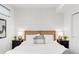Inviting bedroom with patterned wallpaper and comfortable bedding creating a restful atmosphere at 1238 Quitman St # 2, Denver, CO 80204