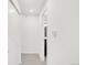 Bright hallway with neutral tones and a glimpse into a closet or additional room at 1238 Quitman St # 2, Denver, CO 80204