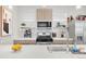 Well-lit kitchen with stainless steel appliances, ample counter space, and modern cabinetry at 1238 Quitman St # 2, Denver, CO 80204
