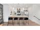 Bright kitchen featuring an island with seating, stainless steel appliances, and modern cabinetry at 1238 Quitman St # 2, Denver, CO 80204