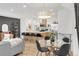 Open-concept space featuring a kitchen, living, and dining area with modern finishes and ample natural light at 1238 Quitman St # 2, Denver, CO 80204