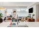 Open-concept living space featuring a fireplace, modern furnishings, and natural light at 1238 Quitman St # 2, Denver, CO 80204