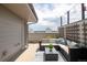 Comfortable patio featuring lounge seating and a decorated privacy lattice, perfect for entertaining at 1238 Quitman St # 2, Denver, CO 80204
