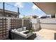 Cozy rooftop patio with comfortable seating, decorative lattice, and stylish outdoor decor at 1238 Quitman St # 2, Denver, CO 80204