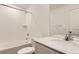 Clean bathroom featuring a shower over tub, with a white quartz countertop at 3919 N Shawnee St, Aurora, CO 80019
