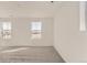 Spacious bedroom features neutral carpet and two windows offering plenty of natural light at 3919 N Shawnee St, Aurora, CO 80019