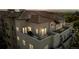 Night aerial view of building highlighting rooftop patio and city lights at 2200 S University Blvd # 513, Denver, CO 80210