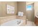 Bathroom with soaking tub and separate shower at 2200 S University Blvd # 513, Denver, CO 80210