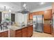 Modern kitchen featuring stainless steel appliances and an island with seating at 2200 S University Blvd # 513, Denver, CO 80210