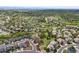Overhead aerial view of a residential neighborhood with mature trees and green spaces at 7367 S Tempe Ct, Aurora, CO 80016