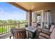 Comfortable balcony featuring a fire pit, seating, and pleasant views at 7367 S Tempe Ct, Aurora, CO 80016