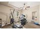 Basement gym featuring exercise equipment, fan, and neutral tones at 7367 S Tempe Ct, Aurora, CO 80016