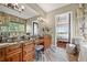 Elegant bathroom featuring dual vanities, a soaking tub, and modern fixtures at 7367 S Tempe Ct, Aurora, CO 80016