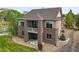 This home boasts a multi-level brick and siding exterior, balcony and manicured landscaping at 7367 S Tempe Ct, Aurora, CO 80016