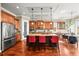 Spacious kitchen with a large island, stainless steel appliances, and ample cabinet space at 7367 S Tempe Ct, Aurora, CO 80016