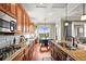 Spacious kitchen with granite countertops, stainless appliances, and a charming breakfast nook at 7367 S Tempe Ct, Aurora, CO 80016