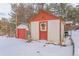 Detached garage and workshop with red doors at 127 Shady Ln, Palmer Lake, CO 80133