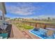 Backyard featuring a patio with a fire pit and ample open space, perfect for outdoor enjoyment at 47349 Lily Ave, Bennett, CO 80102