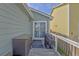 Back deck features a grill, seating, and sliding glass doors leading indoors at 47349 Lily Ave, Bennett, CO 80102