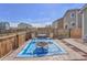 Cozy backyard patio with a fire pit, outdoor seating and blue rug, perfect for relaxing and entertaining at 47349 Lily Ave, Bennett, CO 80102