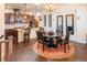 Inviting dining area adjacent to a modern kitchen, perfect for entertaining guests at 24998 E Alder Dr, Aurora, CO 80016